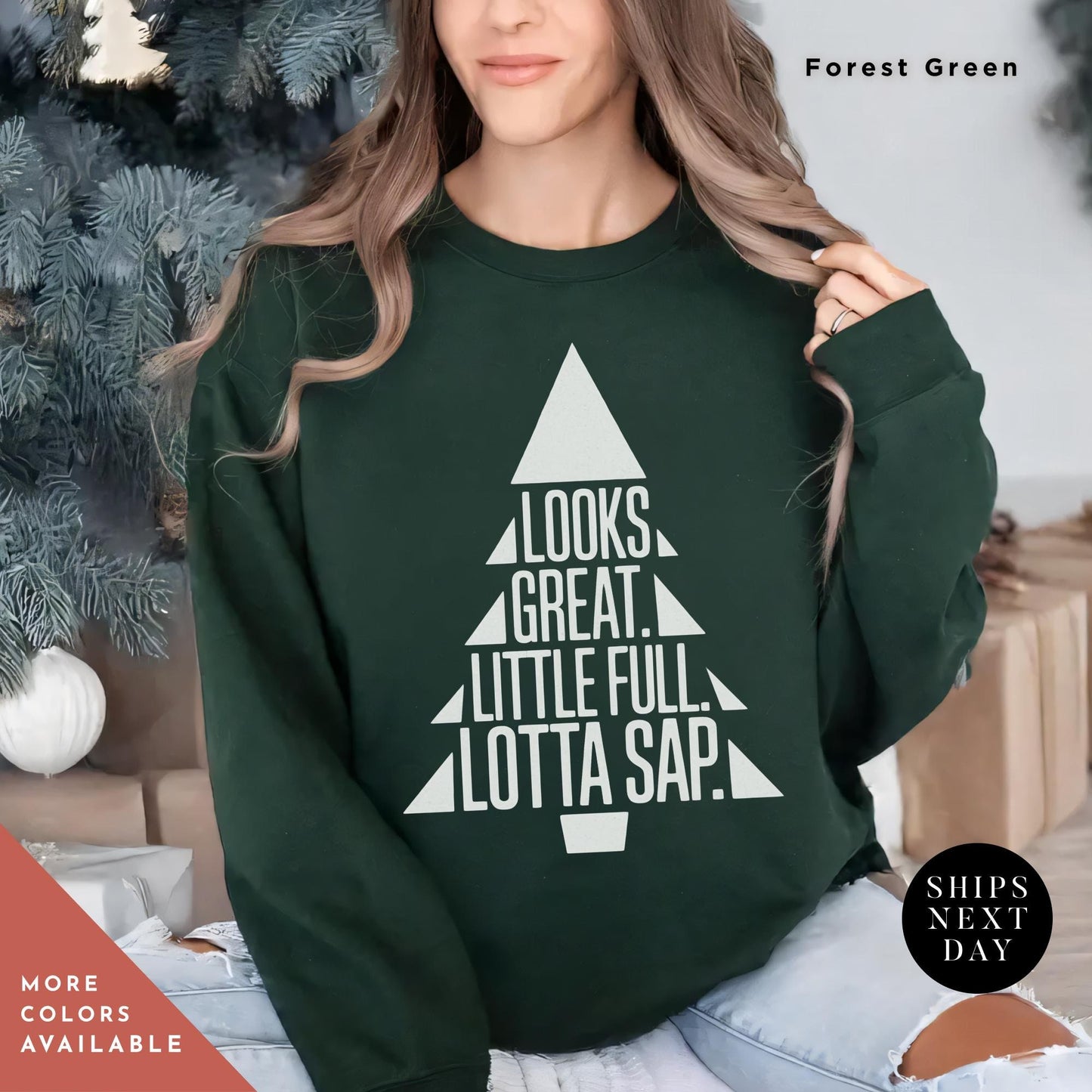 a woman wearing a green sweatshirt that says looks great, little full, lotta sap, christmas tree sweatshirt griswold's tree farm since 1989 crewneck sweatshirt xmas family gift holiday spirit shirt little full lotta sap
