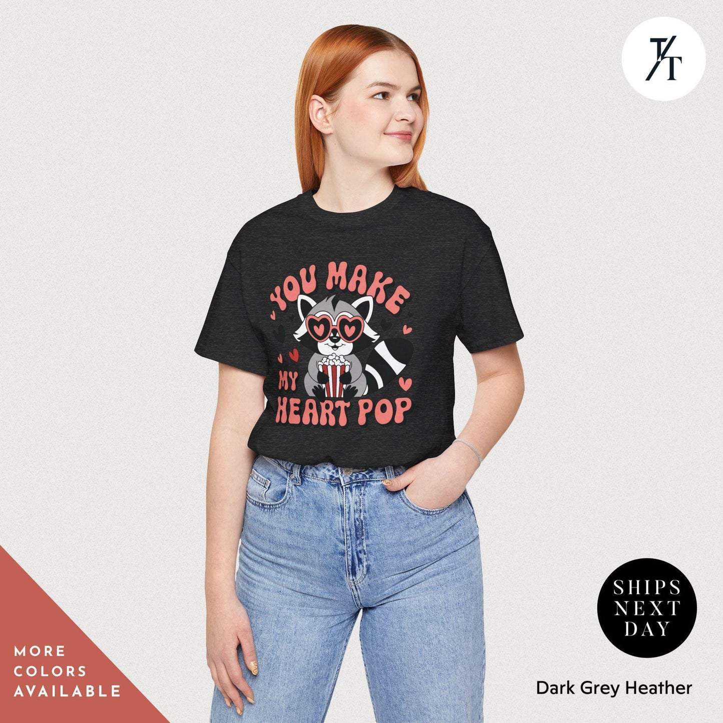 a woman wearing a black t - shirt that says, you make my heart pop