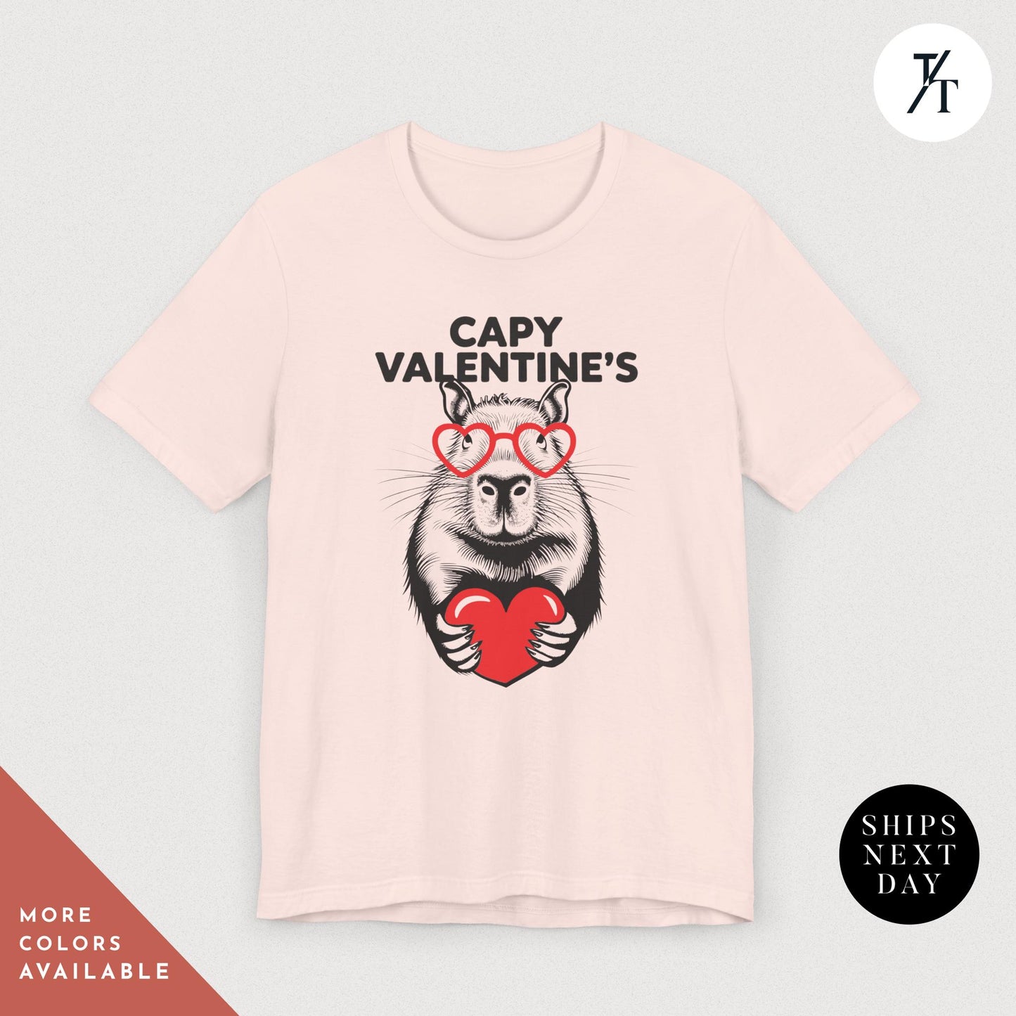 a pink t - shirt with an image of a capybara holding a heart that says Capy Valentines, Capybara Valentines Shirt, Gift For Her, Capybara Lover Gift, Funny Capybaras Shirt, Valentines Day Gifts, Animal Lover Gifts, Capybaras tee
