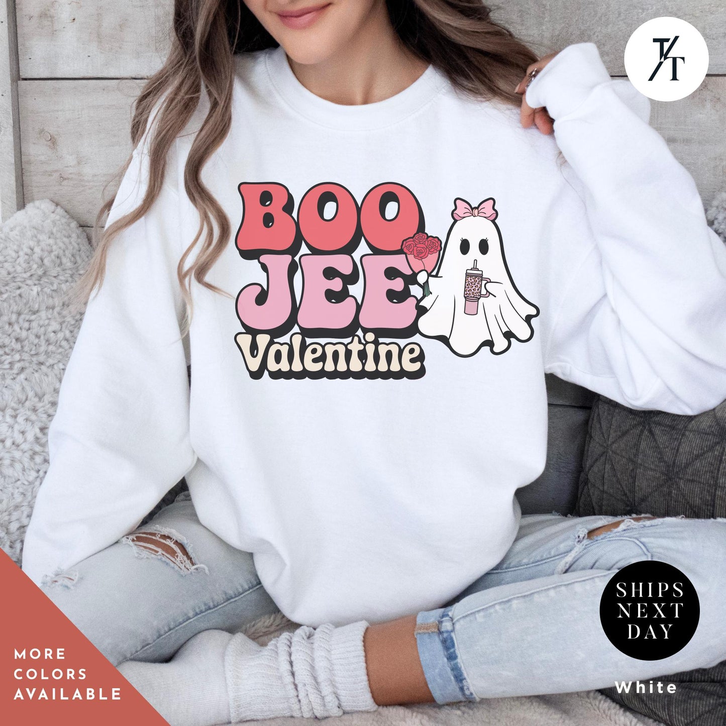 Woman wearing a sweatshirtwith a ghost holding roses and a stanley cup hat says "Boo Jee Valentine"