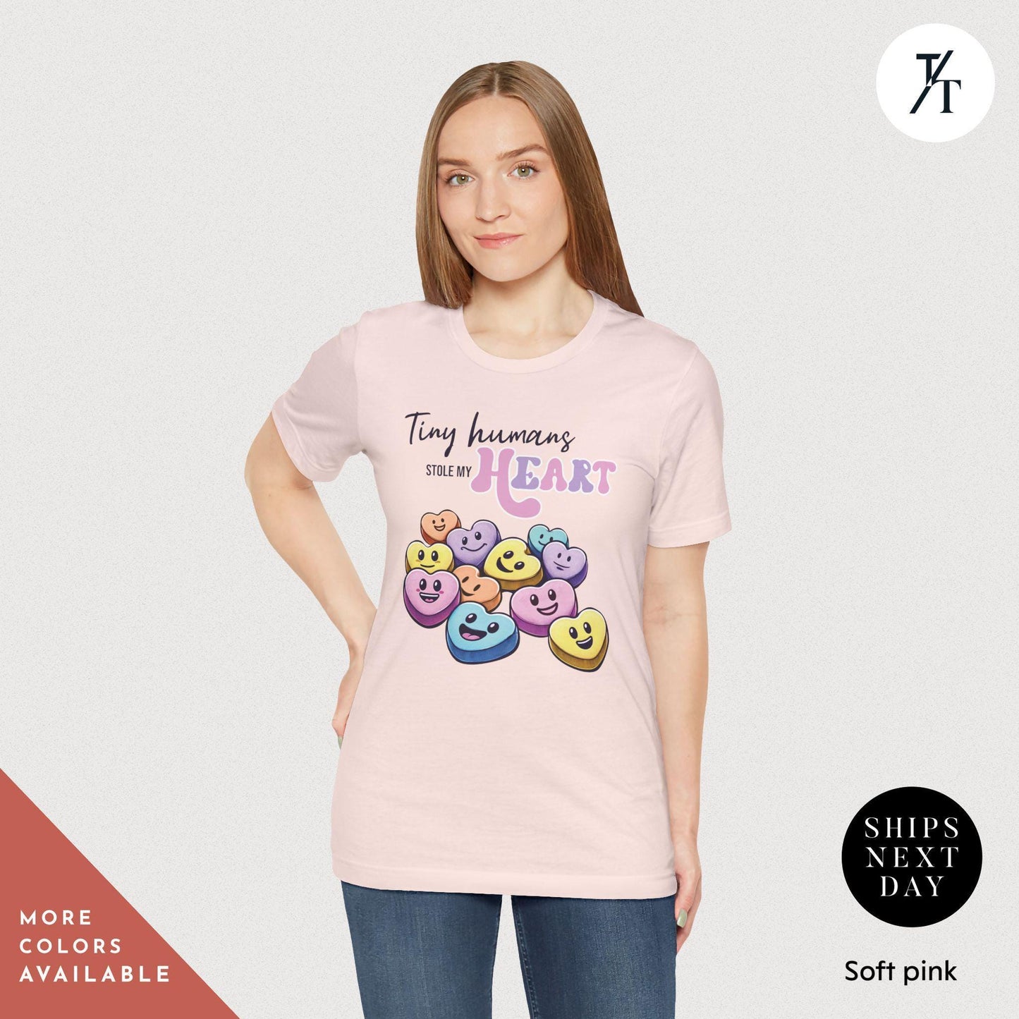 a woman wearing a pink tshirt with smiley faces on it