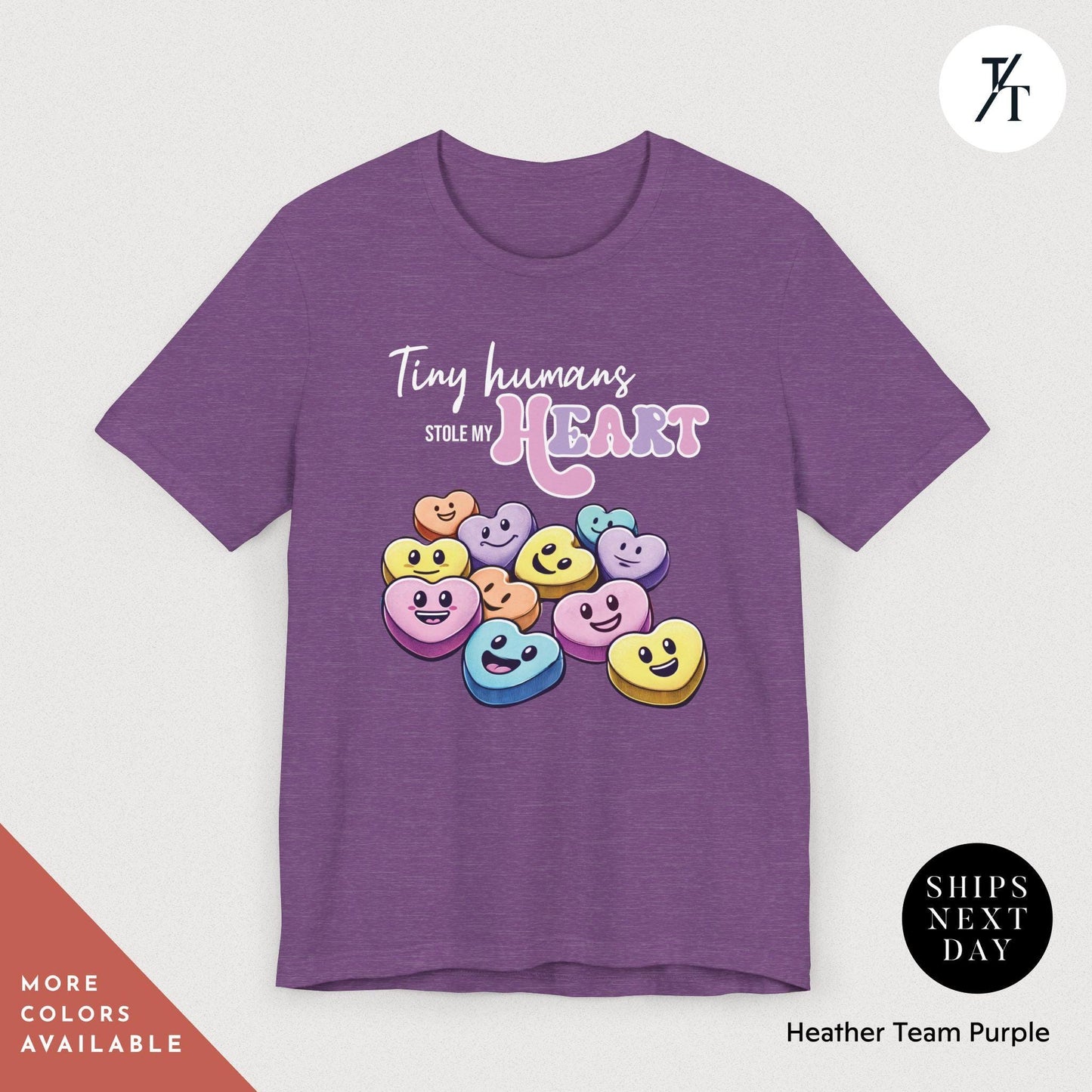 a purple t - shirt with smiley faces on it