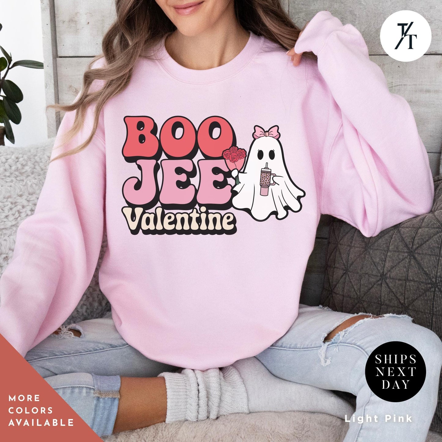 Woman wearing a sweatshirtwith a ghost holding roses and a stanley cup hat says "Boo Jee Valentine"