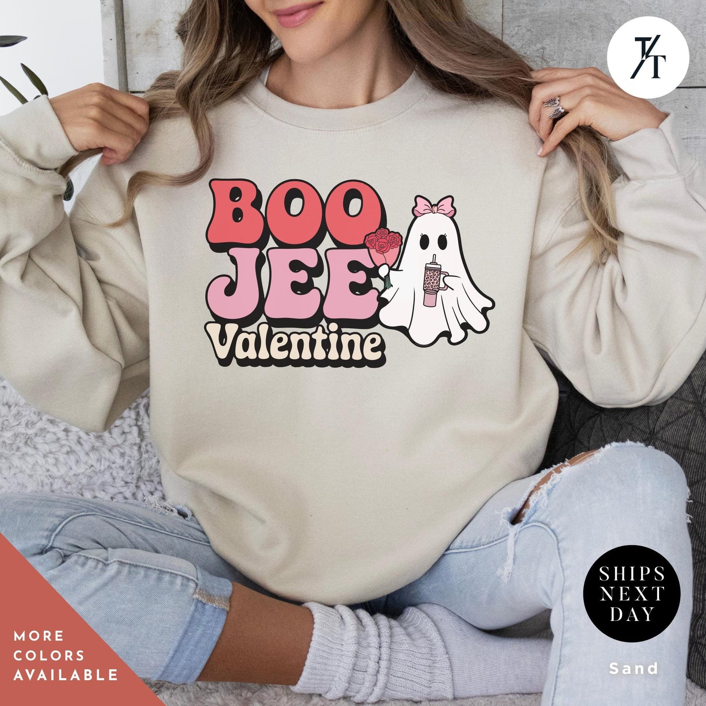 Woman wearing a sweatshirtwith a ghost holding roses and a stanley cup hat says "Boo Jee Valentine"