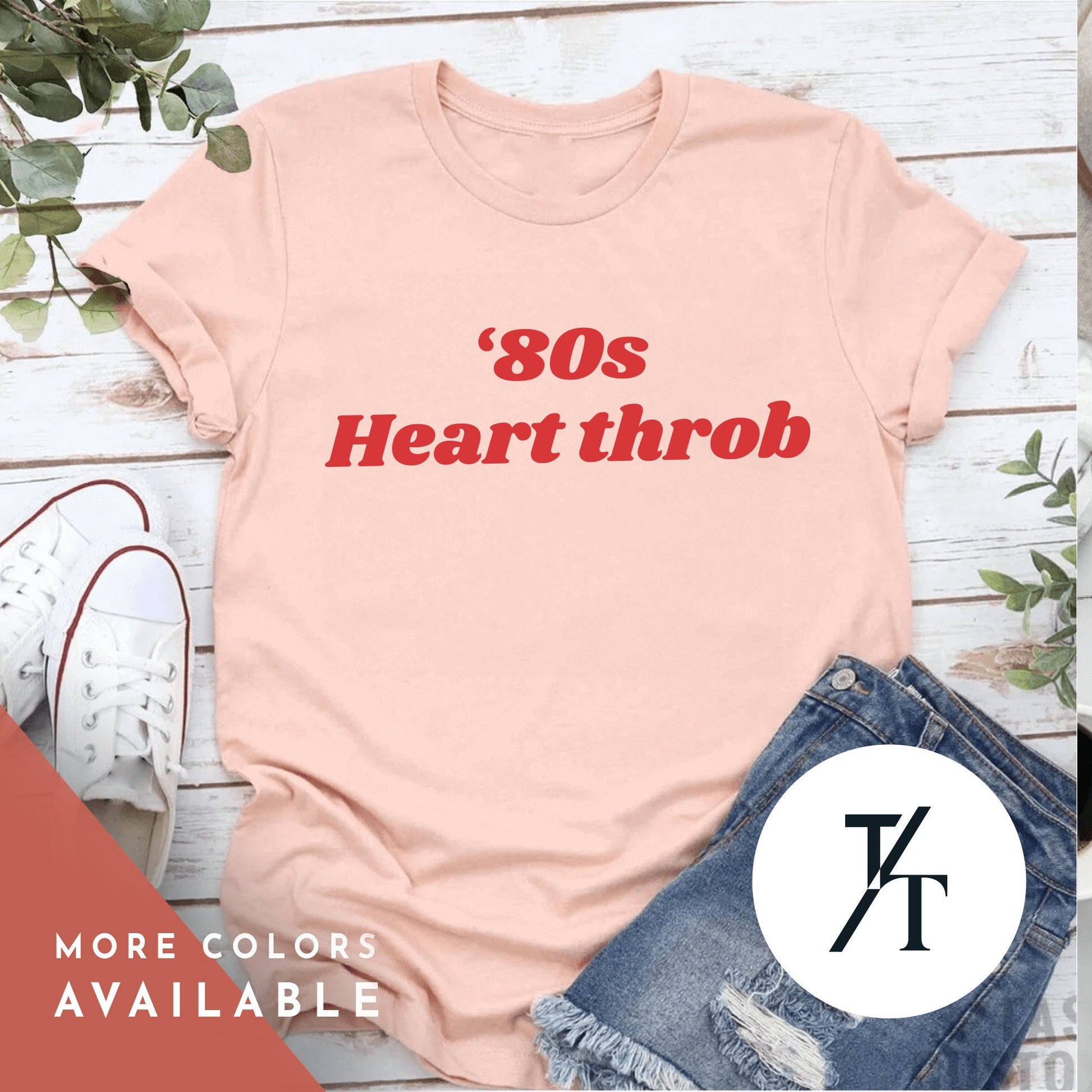 a pink shirt with the words 80s heartthrob on it