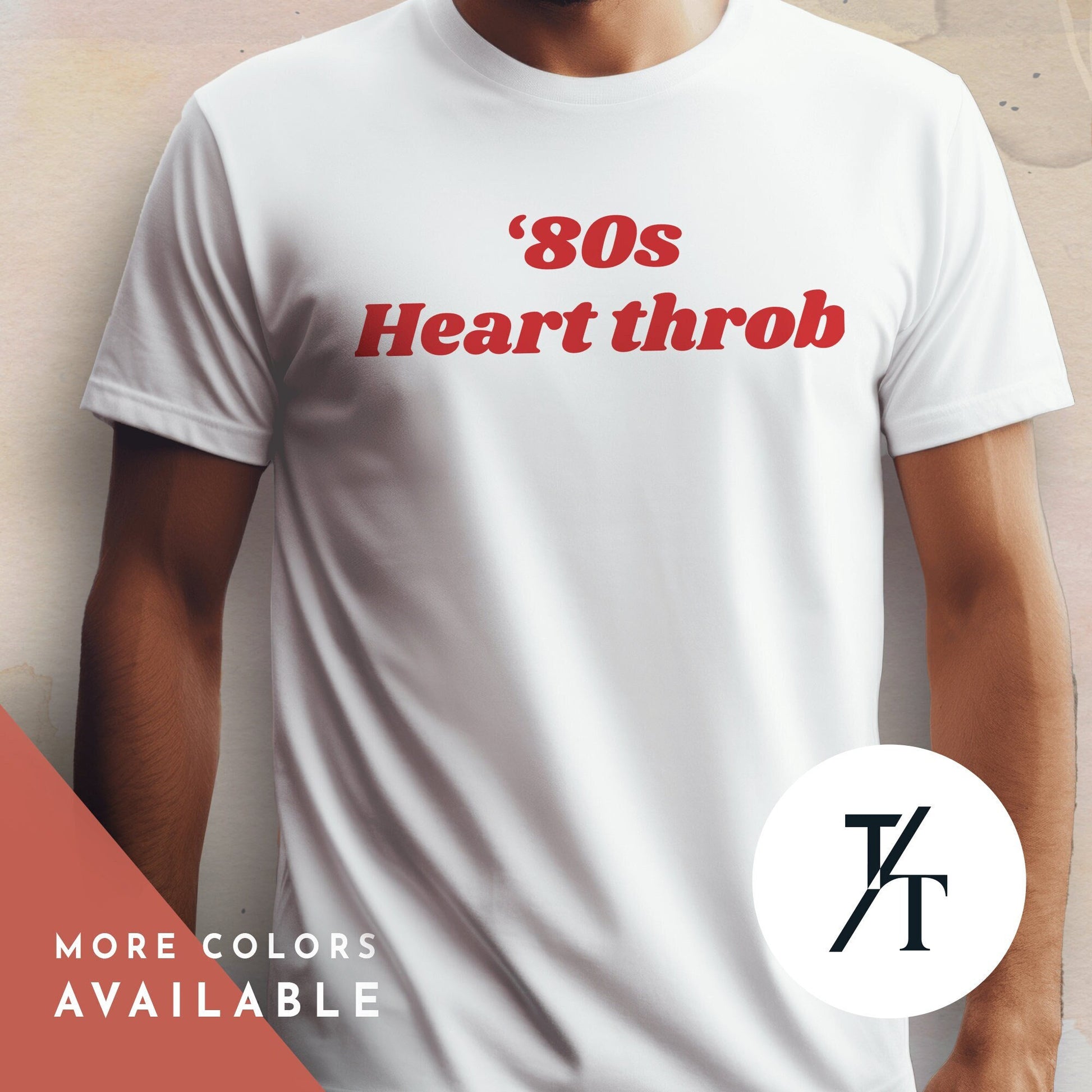 a man wearing a white t - shirt with the words 80&#39;s heart throb