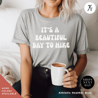 a woman sitting on a bed holding a cup of coffee