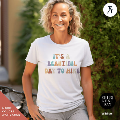 a woman wearing a t - shirt that says it&#39;s a beautiful day to