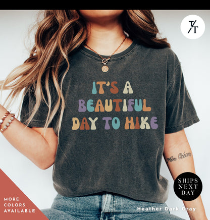a woman wearing a t - shirt that says it&#39;s a beautiful day to