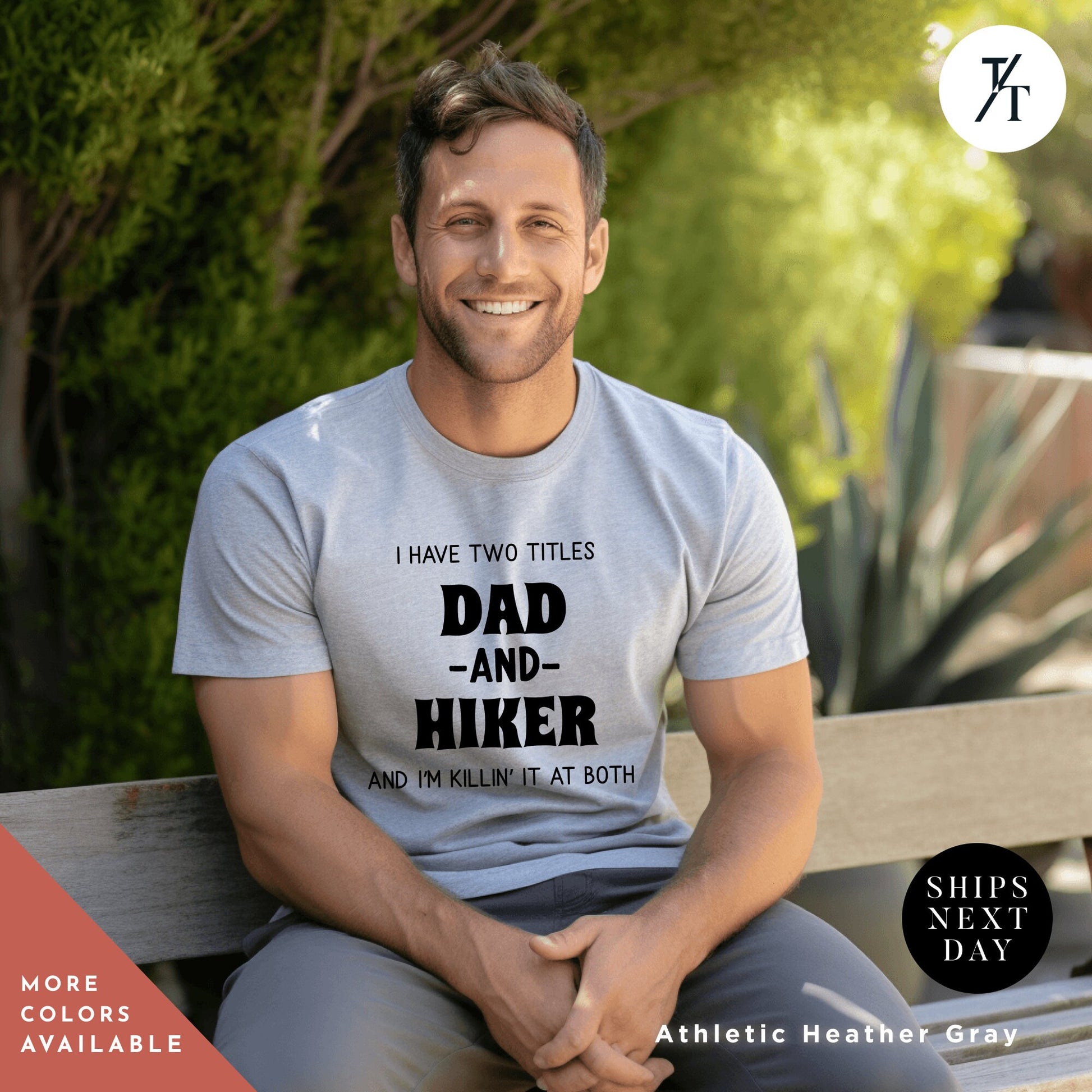 a man sitting on a bench wearing a t - shirt that says i have two