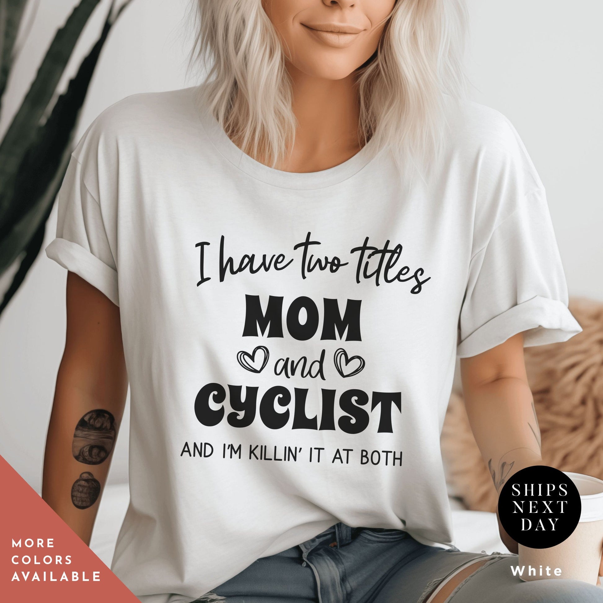 a woman wearing a t - shirt that says i have two titles mom and cyclist