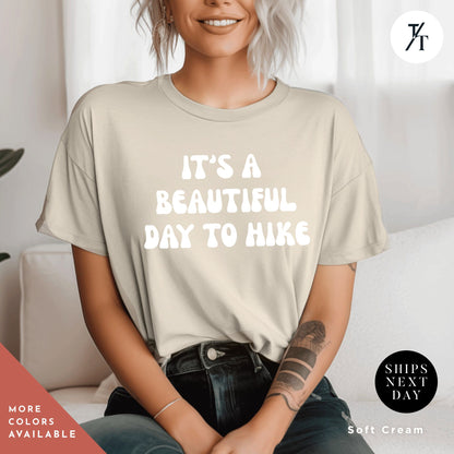 a woman wearing a t - shirt that says it&#39;s a beautiful day to