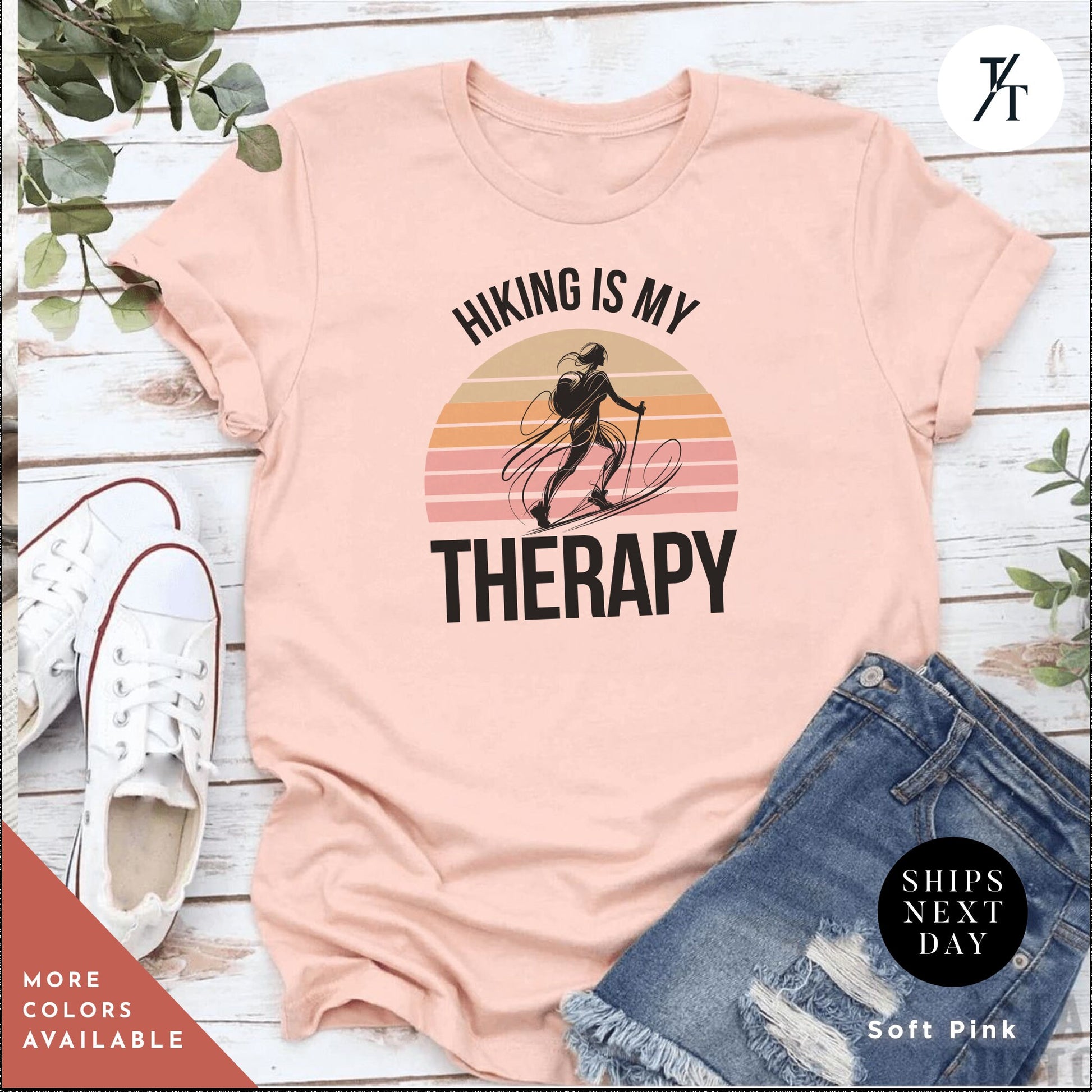 a pink shirt that says hiking is my therapy
