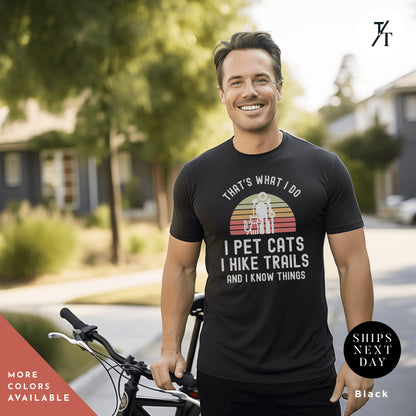 a man standing next to a bike wearing a black shirt