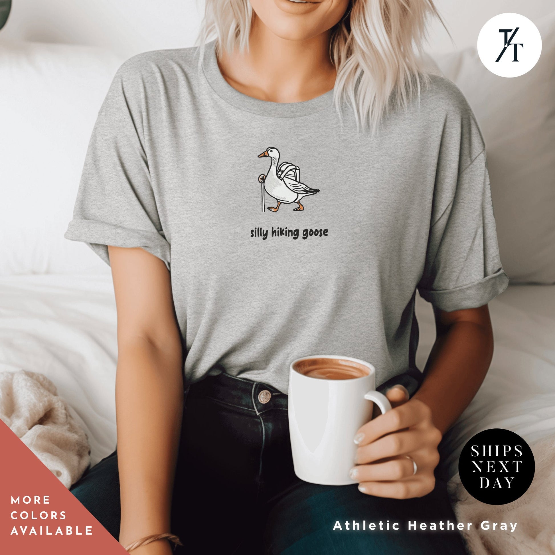 a woman sitting on a bed holding a cup of coffee