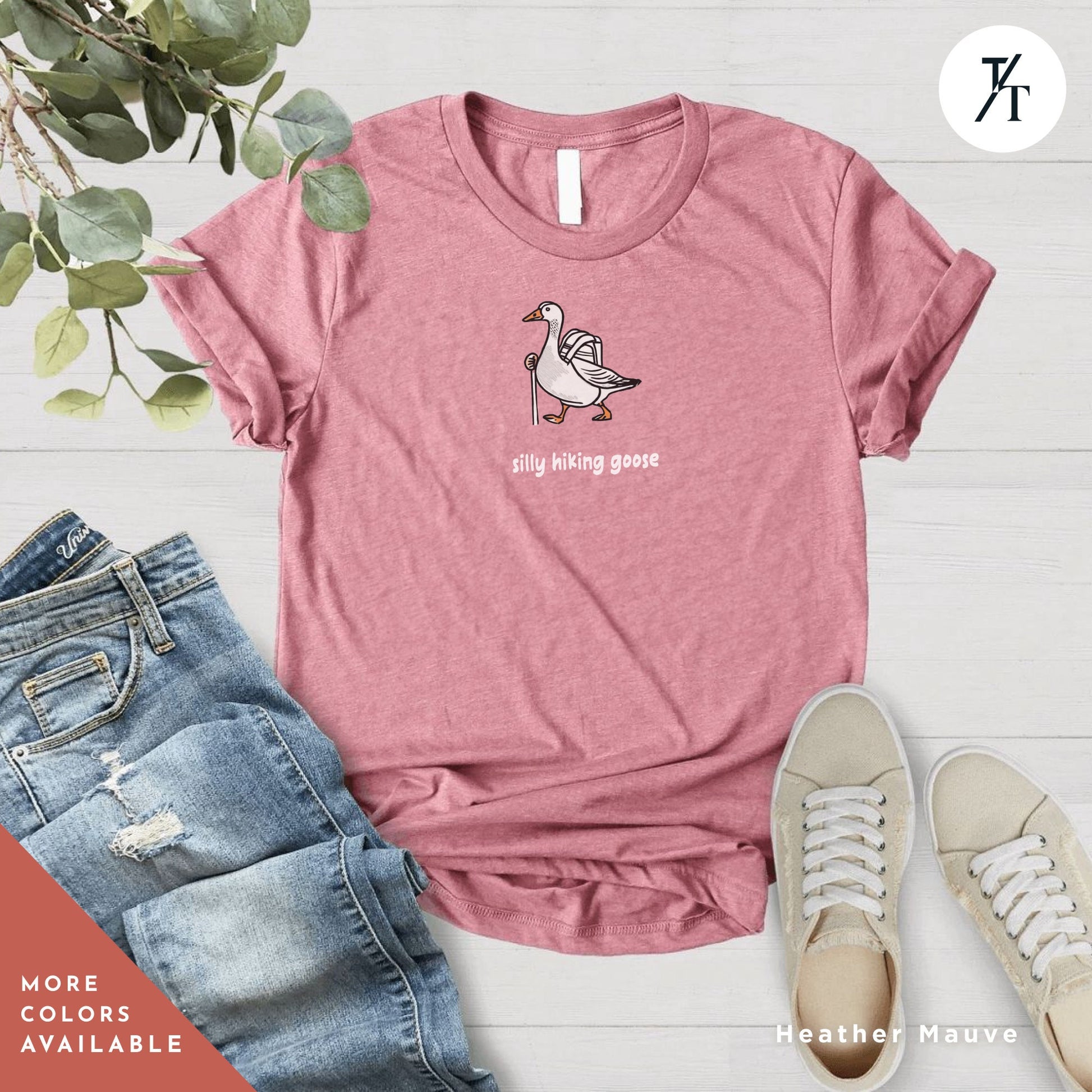 a pink shirt with a picture of a duck on it