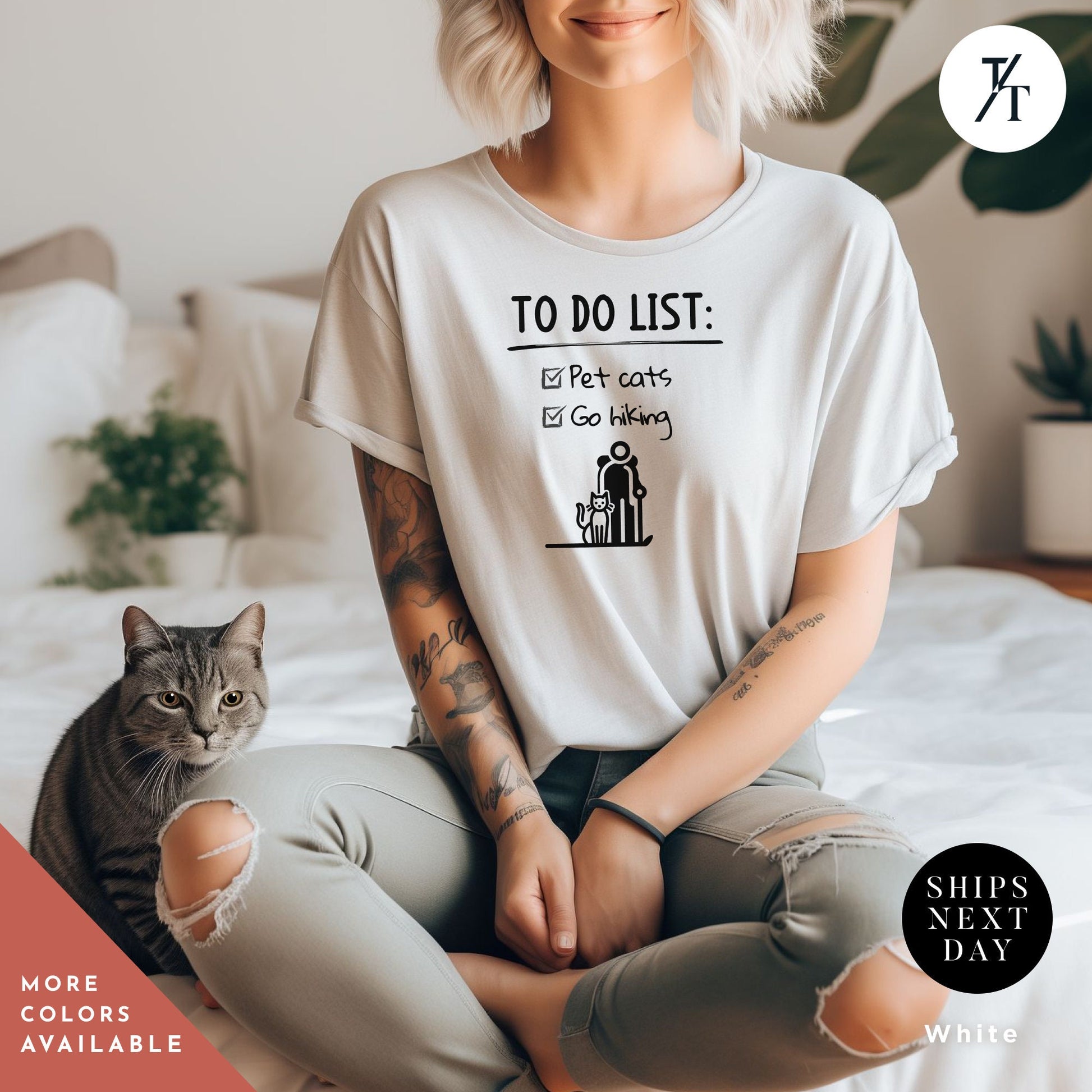 a woman sitting on a bed with a cat