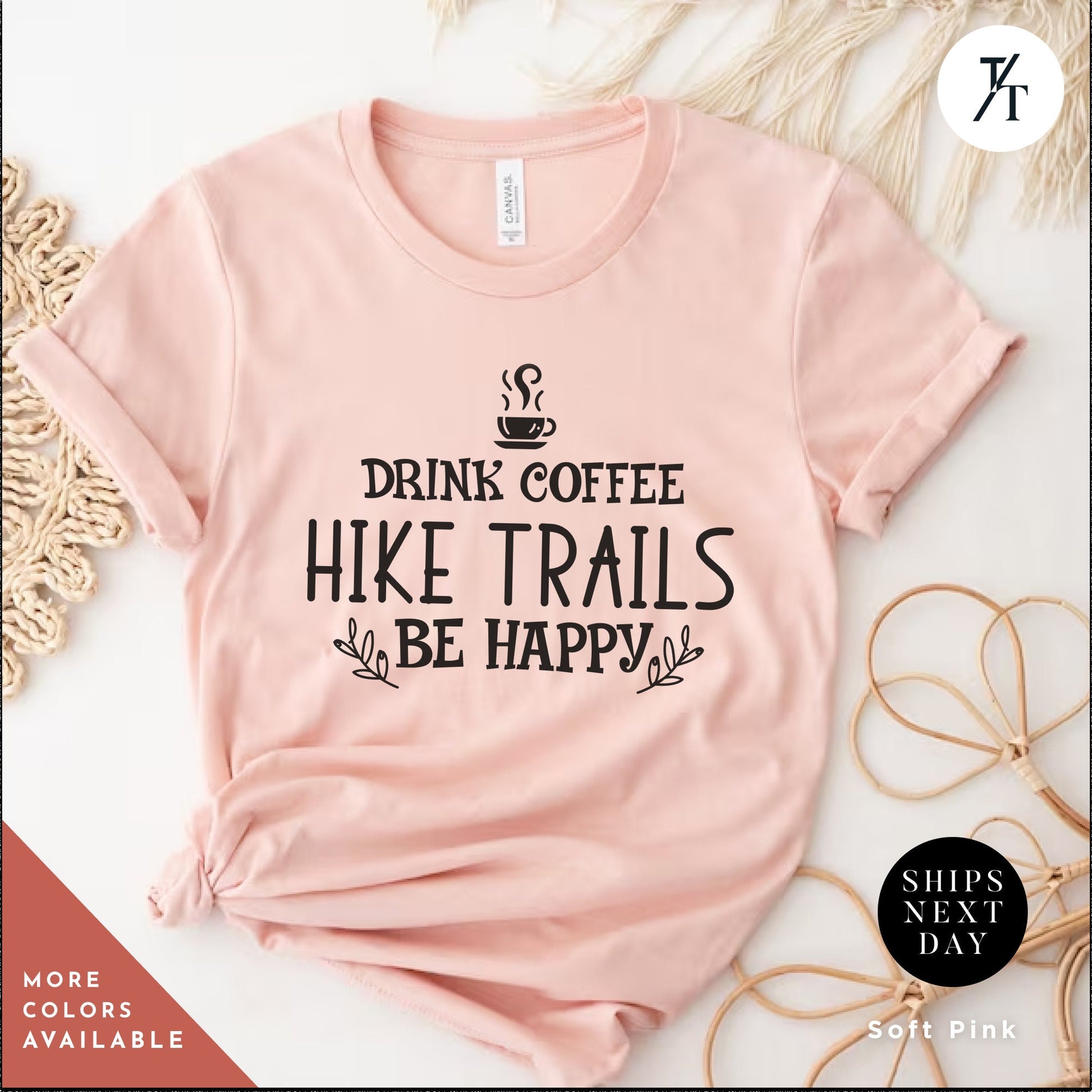 a pink shirt that says drink coffee hike trails be happy