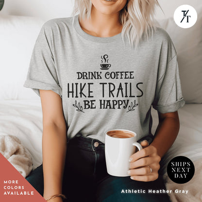 a woman sitting on a bed holding a cup of coffee Hiking Shirt, Hiking Gift, Nature Shirt, Travel tee, Mountain tShirt, Gift For Hiker, Wanderlust t-Shirt, Camping tshirt, hiking tee