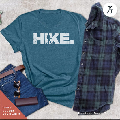 a shirt that says hike next to a pair of jeans
