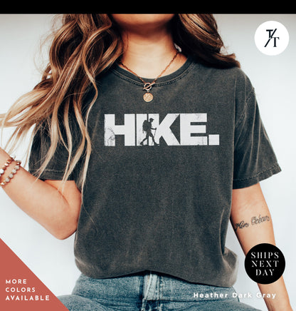 a woman wearing a shirt that says hike