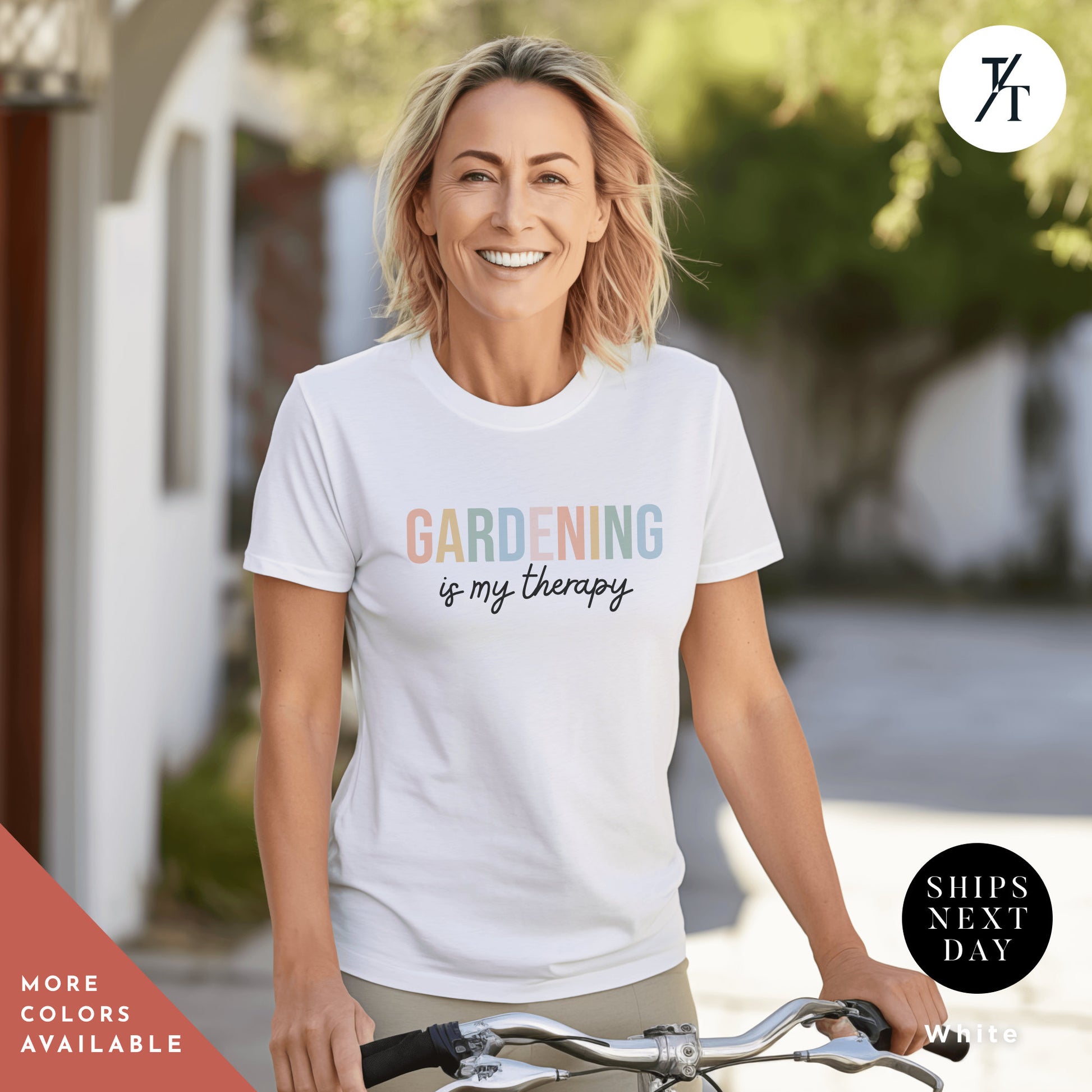 a woman riding a bike wearing a white t - shirt