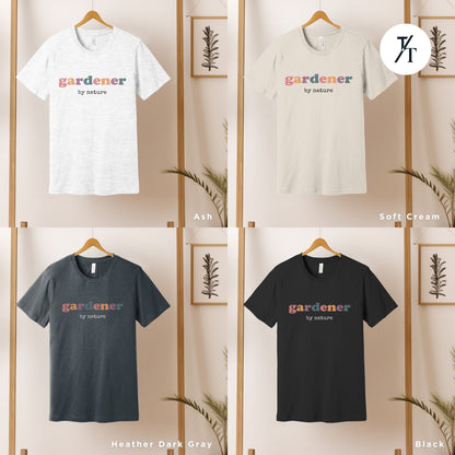 four t - shirts hanging on a wooden rack