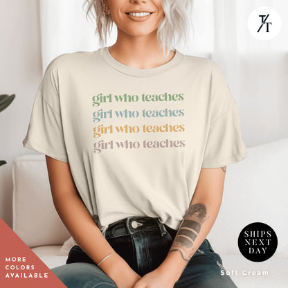 a woman sitting on a couch wearing a t - shirt that says girl who teaches