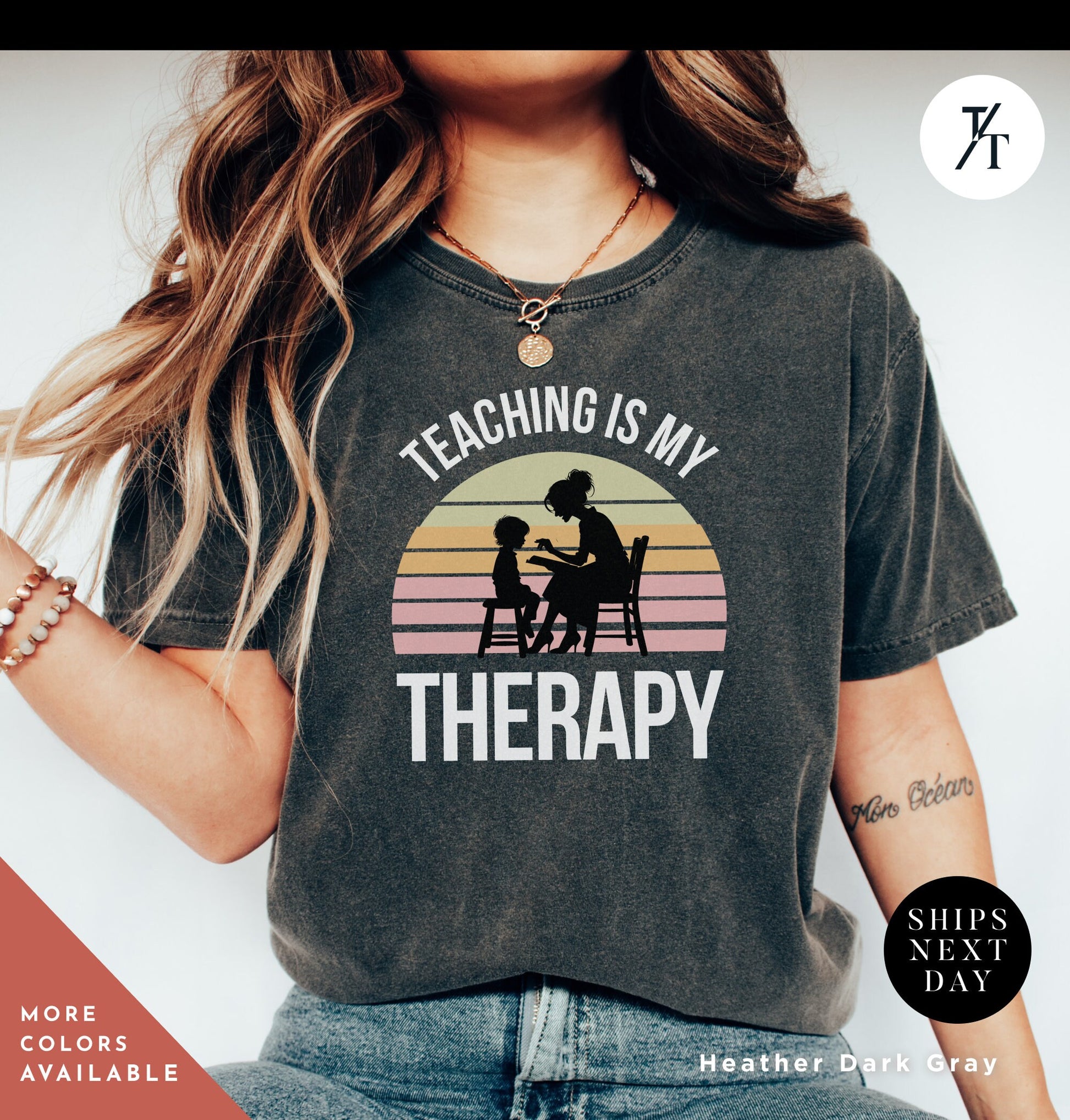 a woman wearing a shirt that says teaching is my therapy