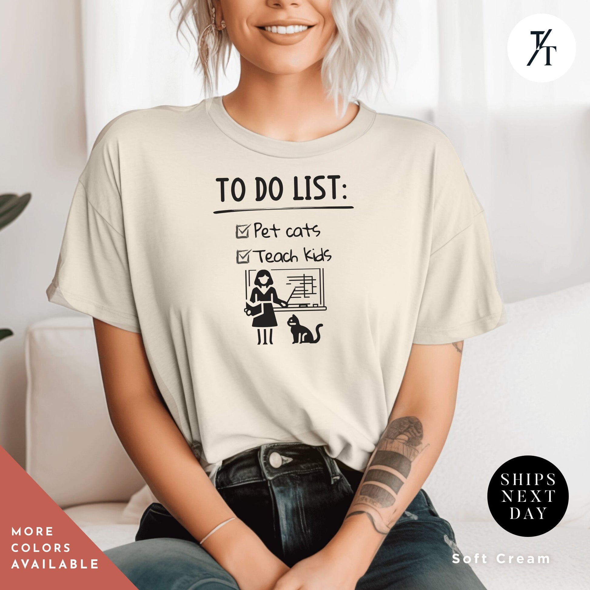 a woman sitting on a couch wearing a t - shirt that says to do list
