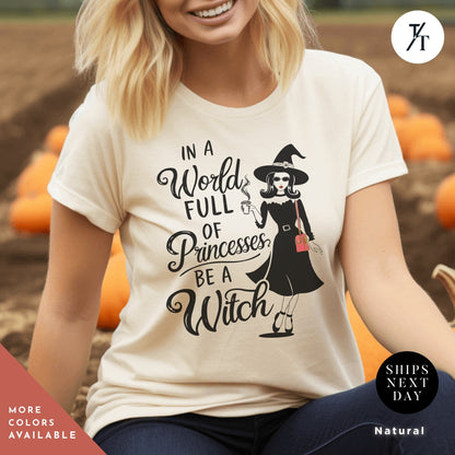 a woman wearing a t - shirt that says in a world full of princesses, , In a world full of princesses be a witch shirt, Halloween Witch Tee, Halloween Party Tee, Girl Princess Funny Witches Wicca Shirt Gift