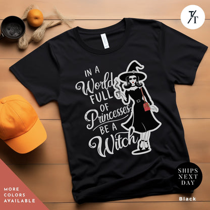 a t - shirt with the words in a world full of princesses be a WITCH, In a world full of princesses be a witch shirt, Halloween Witch Tee, Halloween Party Tee, Girl Princess Funny Witches Wicca Shirt Gift