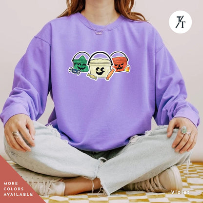 a woman sitting in a yoga pose with her hands in her pockets, Comfort colors halloween boo bucket sweatshirt, Boo Bucket Shirt, Mcdonalds Halloween Sweatshirt, Retro 90S Crewneck sweater 90S Ghoul