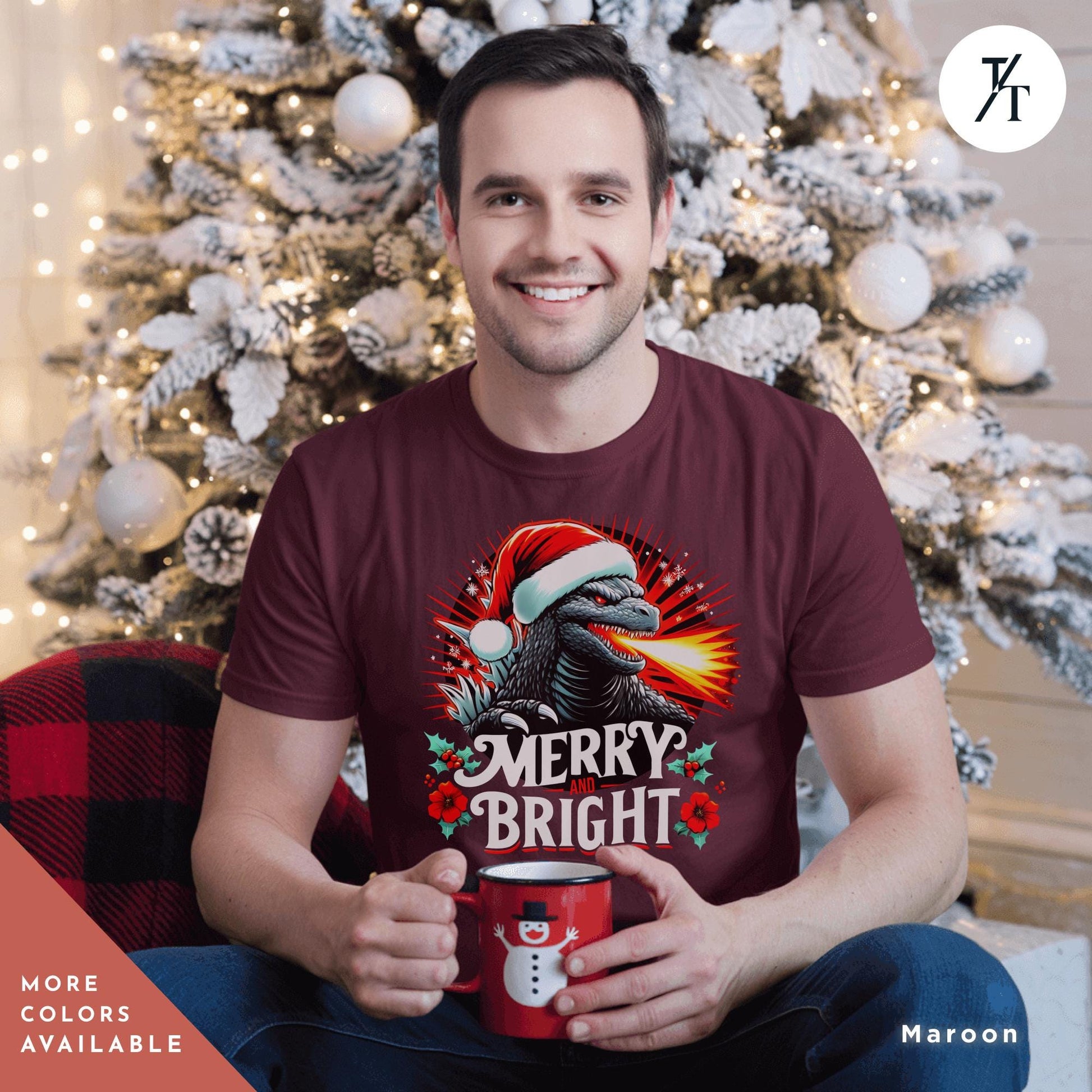a man sitting in front of a christmas tree holding a coffee mug wearing a  Godzilla christmas shirt, Gift For Him, Funny Christmas T-Shirt Men, Ugly Godzilla Holiday Party tShirt, King Of The Monsters Gifts For Dad
