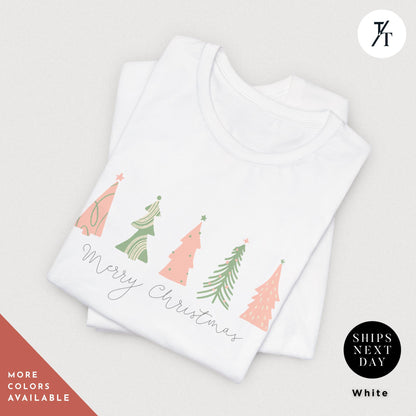 a shirt with 4 pink Christmas trees that says &quot;Merry Christmas&quot; North Pole Christmas Tree Farm Shirt, Coquette Pink Christmas Tree Shirt, Xmas Gift, Farm Fresh Xmas Shirt, Women Holiday Tee