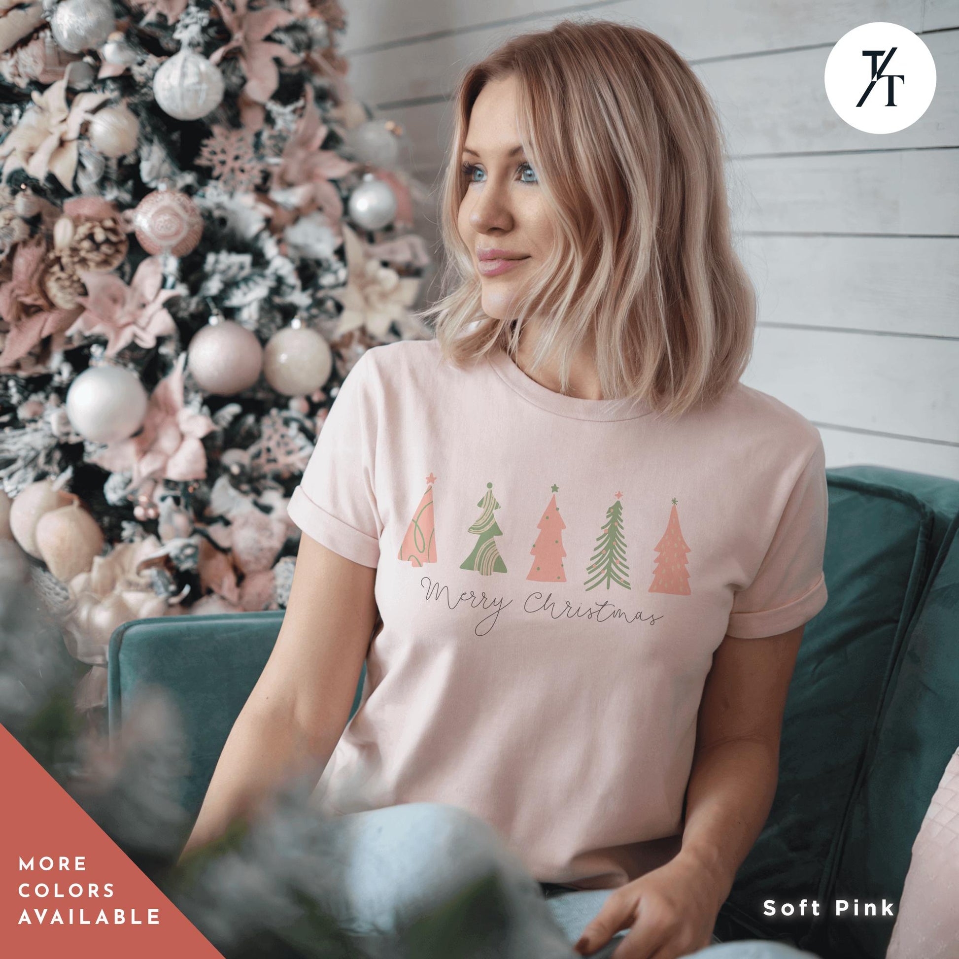 a woman sitting on a couch in front of a christmas tree, a shirt with 4 pink Christmas trees that says &quot;Merry Christmas&quot; North Pole Christmas Tree Farm Shirt, Coquette Pink Christmas Tree Shirt, Xmas Gift, Farm Fresh Xmas Shirt, Women Holiday Tee