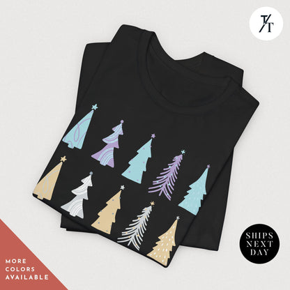 a black t - shirt with colorful christmas trees on it, Coquette Christmas Tree Shirt, Pine Tree Watercolor tee, North Pole Christmas Farm Shirt, Xmas Gift, Farm Fresh Xmas, Women Holiday Tee,