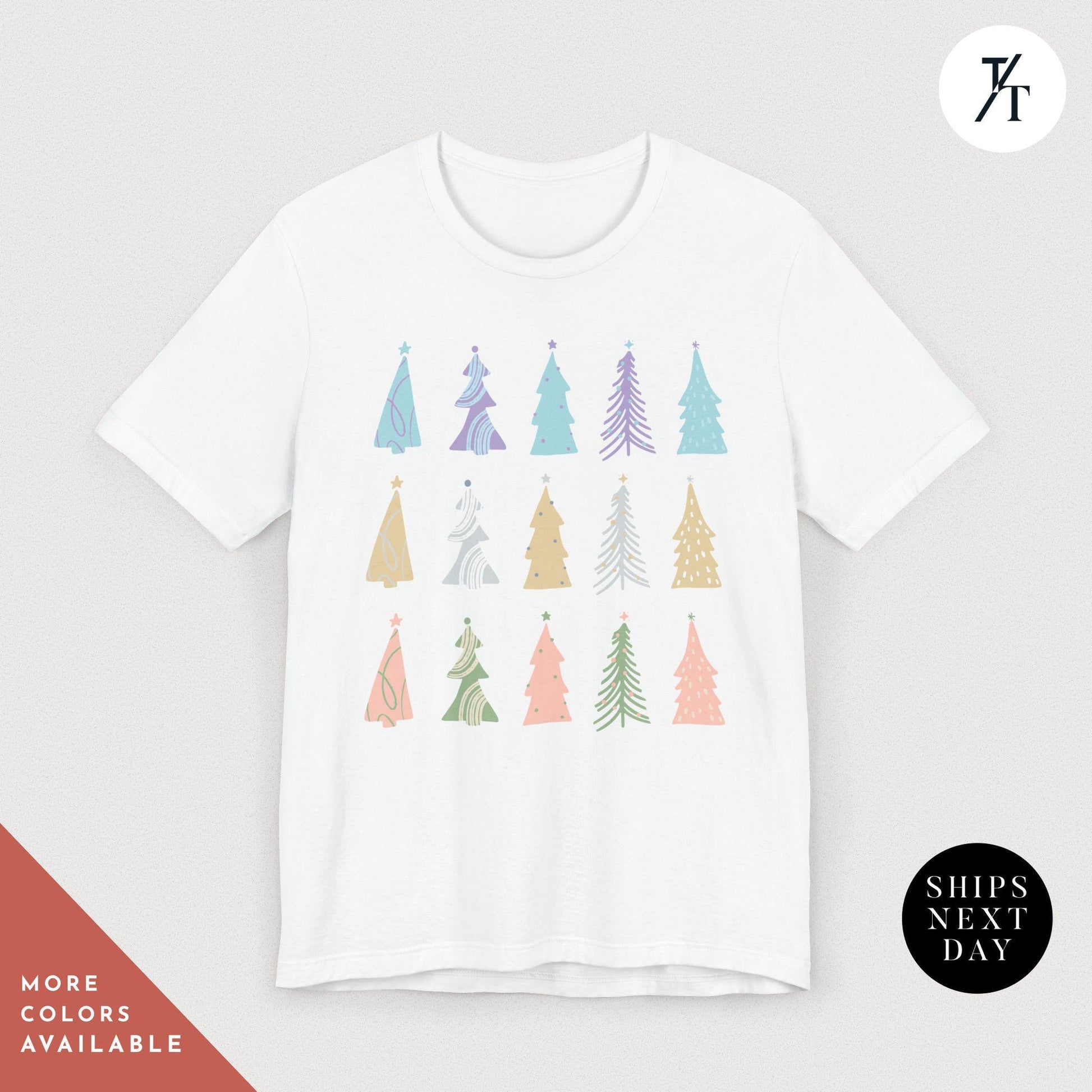 a white t - shirt with colorful trees on it, Coquette Christmas Tree Shirt, Pine Tree Watercolor tee, North Pole Christmas Farm Shirt, Xmas Gift, Farm Fresh Xmas, Women Holiday Tee,