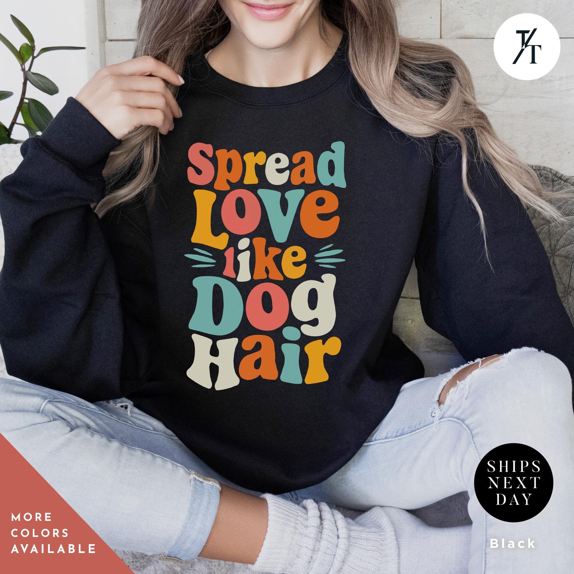a woman sitting on a couch wearing a black shirt with the words spread love like