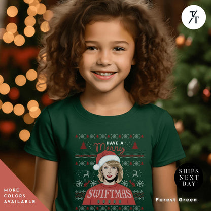 a young girl wearing a green christmas t - shirt, , Have a Merry Swiftmas Shirt taylor swiftie merch kids outfit, ugly Christmas Shirt kids, Taylor swiftie Christmas Shirt, Gift For Swifties