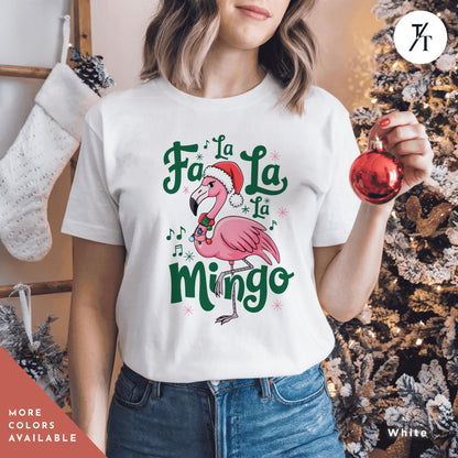 a woman holding a christmas ornament in front of a christmas tree