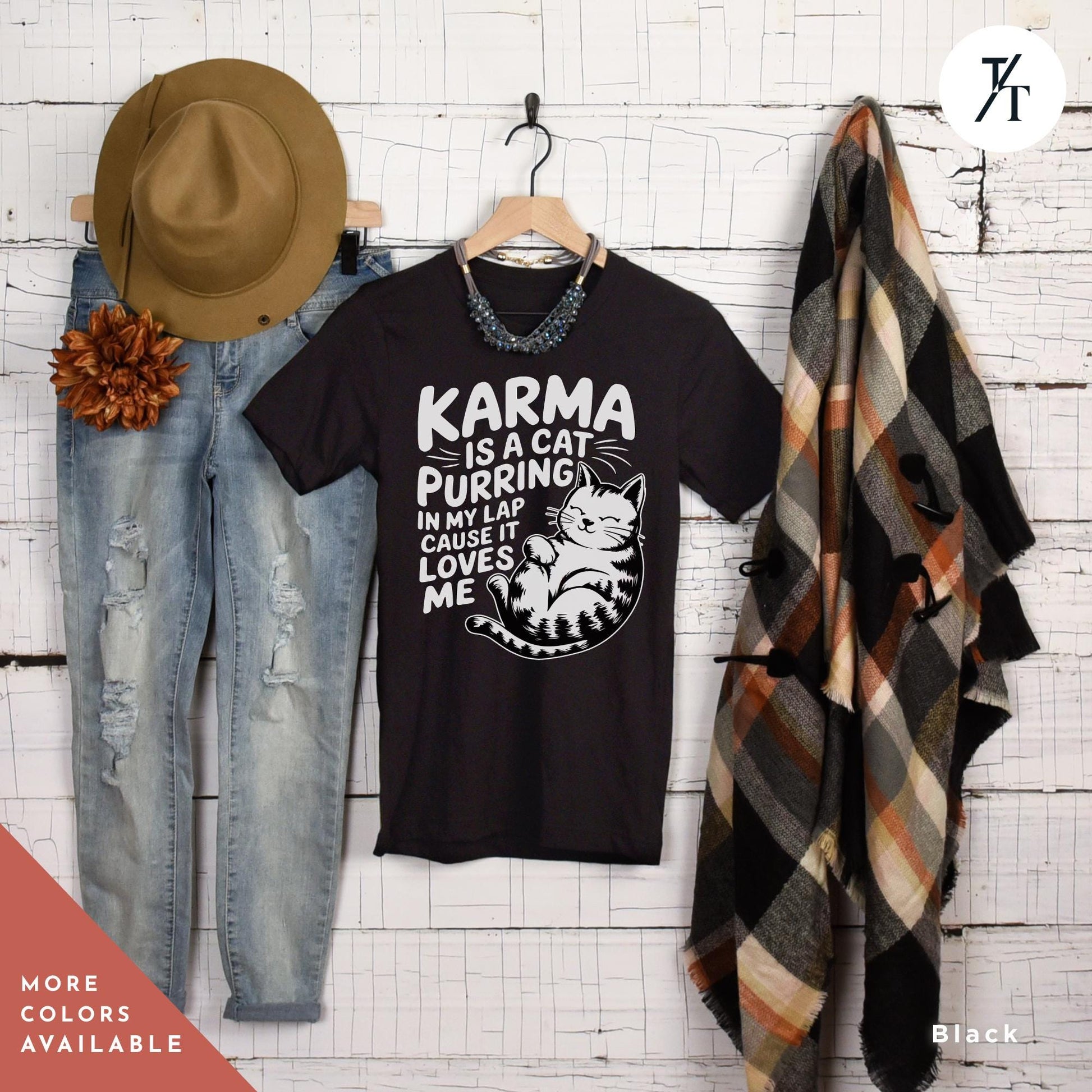 a pair of jeans and a t - shirt hanging on a wall, Karma is a Cat Purring in my Lap Cause it Loves Me Shirt Taylor Swiftie Merch, Karma Is A Cat Shirt, Cats Lover Shirts, Eras Concert Shirts