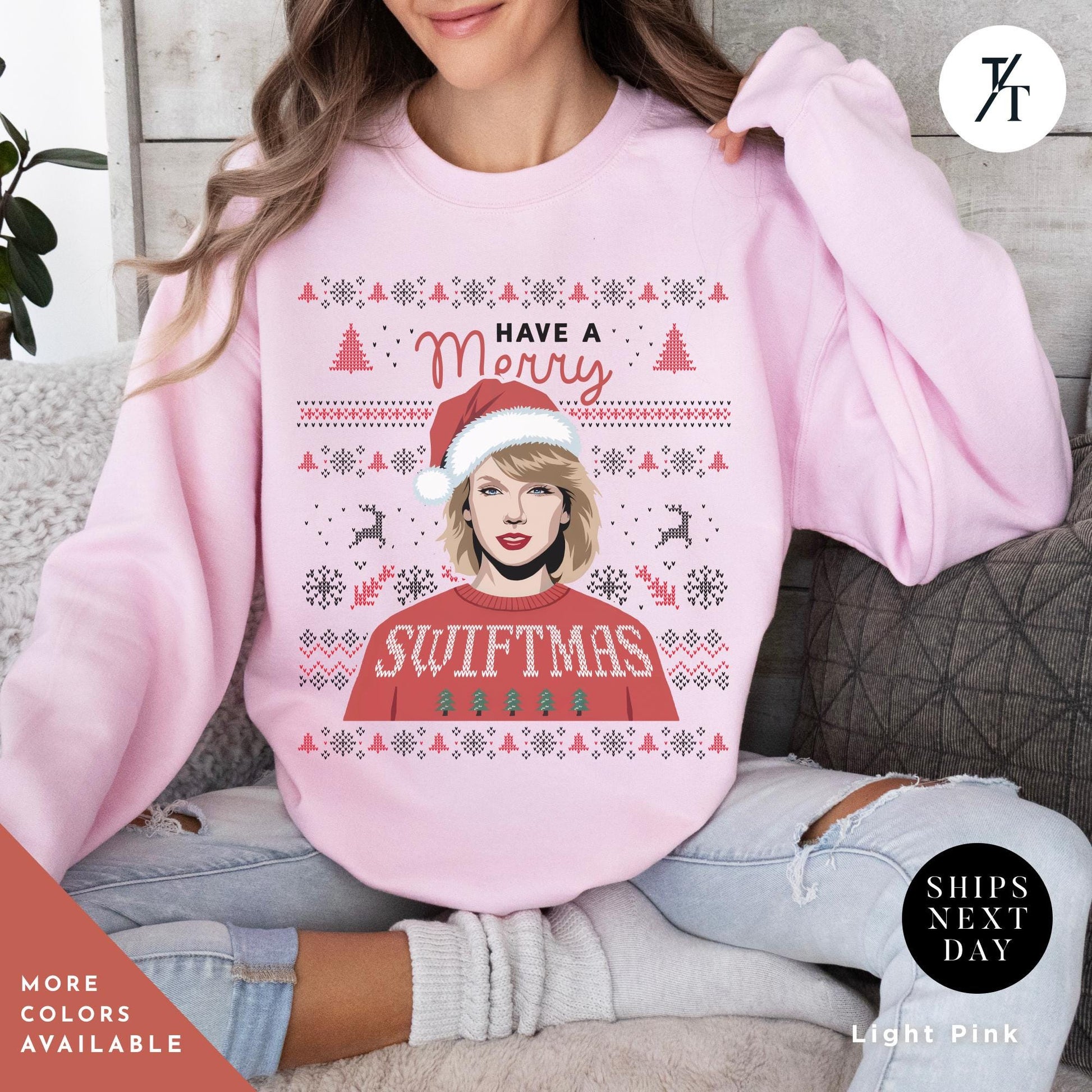a woman wearing a pink sweater with a picture of a woman wearing a santa hat