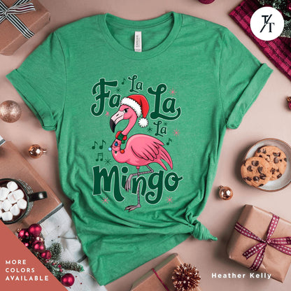 a green shirt with a pink flamingo wearing a santa hat
