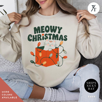 a woman wearing a sweatshirt that says meowy christmasMeowy Christmas Sweater - Catmas Sweatshirt, Meowy Christmas Sweatshirt, Gift For Cat Mom, Cute Cat Mom Sweatshirts, Holiday Sweatshirts