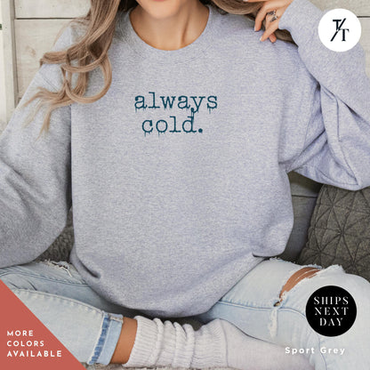a woman wearing a sweatshirt that says alwayss cold, Always Cold Sweatshirt, Funny Cold Winter Sweatshirt, womens winter gift, cute fall gift, christmas gift, winter graphic Holiday Sweatshirt