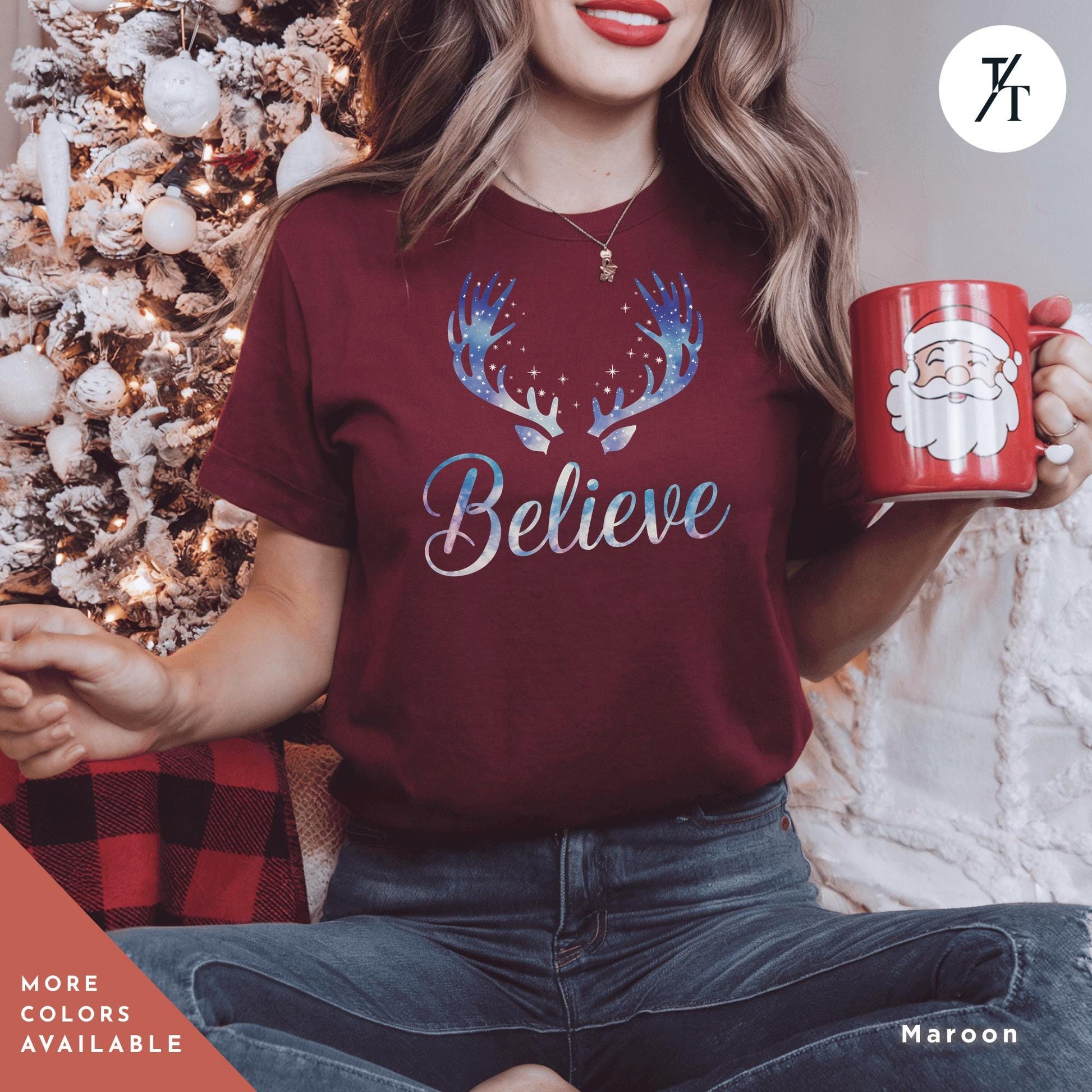 Believe in Miracles Santa Shirt, Christmas Miracle Reindeer Shirt, Merry Christmas Tee, Believer Tee, Santa Believe Shirts Believe Quotea woman holding a red mug in front of a christmas tree