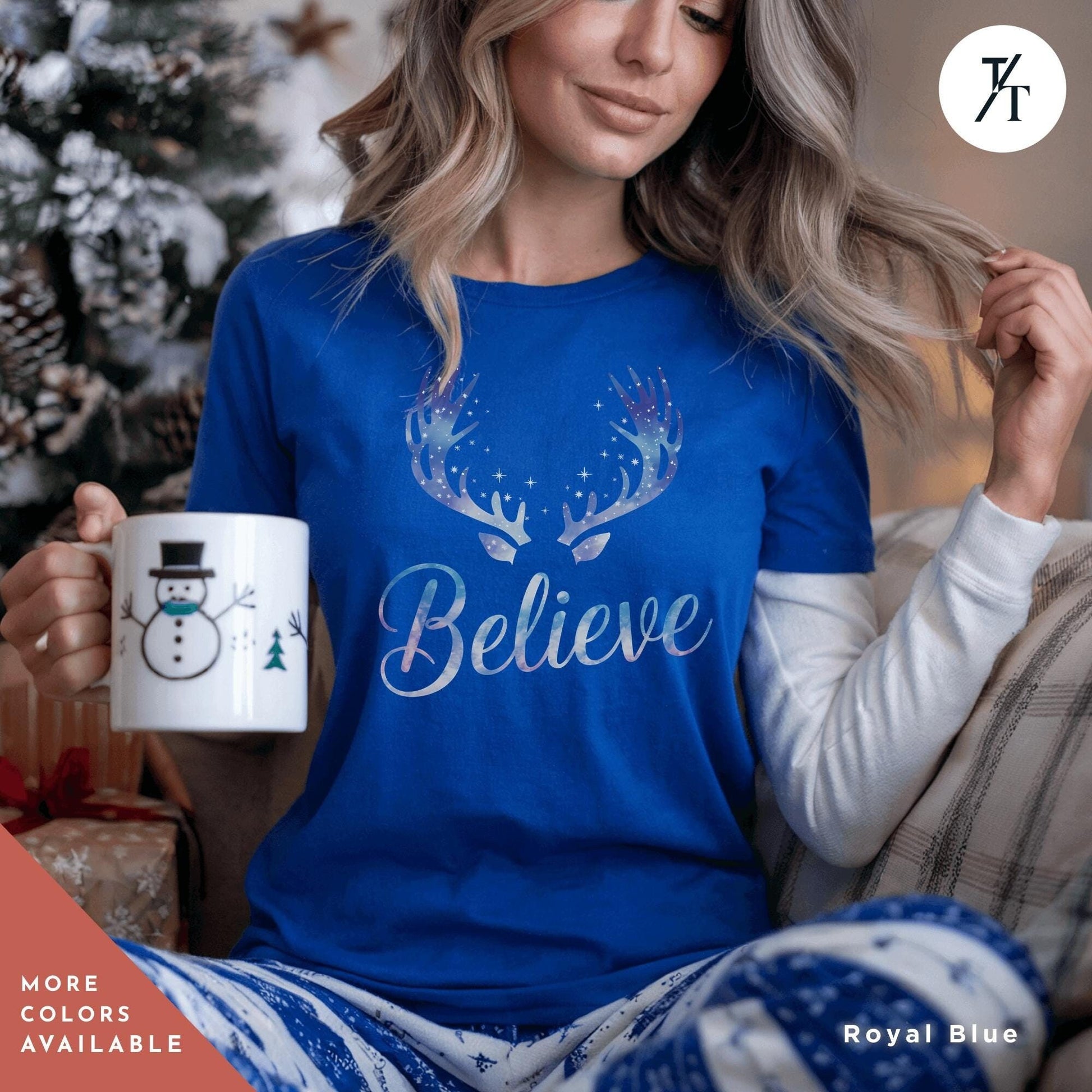a woman sitting on a couch holding a coffee mug, Believe in Miracles Santa Shirt, Christmas Miracle Reindeer Shirt, Merry Christmas Tee, Believer Tee, Santa Believe Shirts Believe Quote