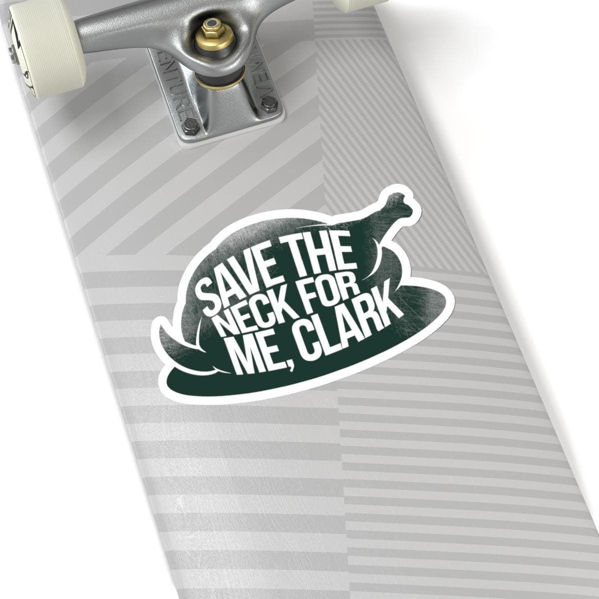 a skateboard with a sticker saying save the neck for me clark, National Lampoons Decal, Christmas Vacation stickers, Chevy Chase Stocking Stuffer, Funny You Serious Clark Christmas Vinyl Laptop Stickers