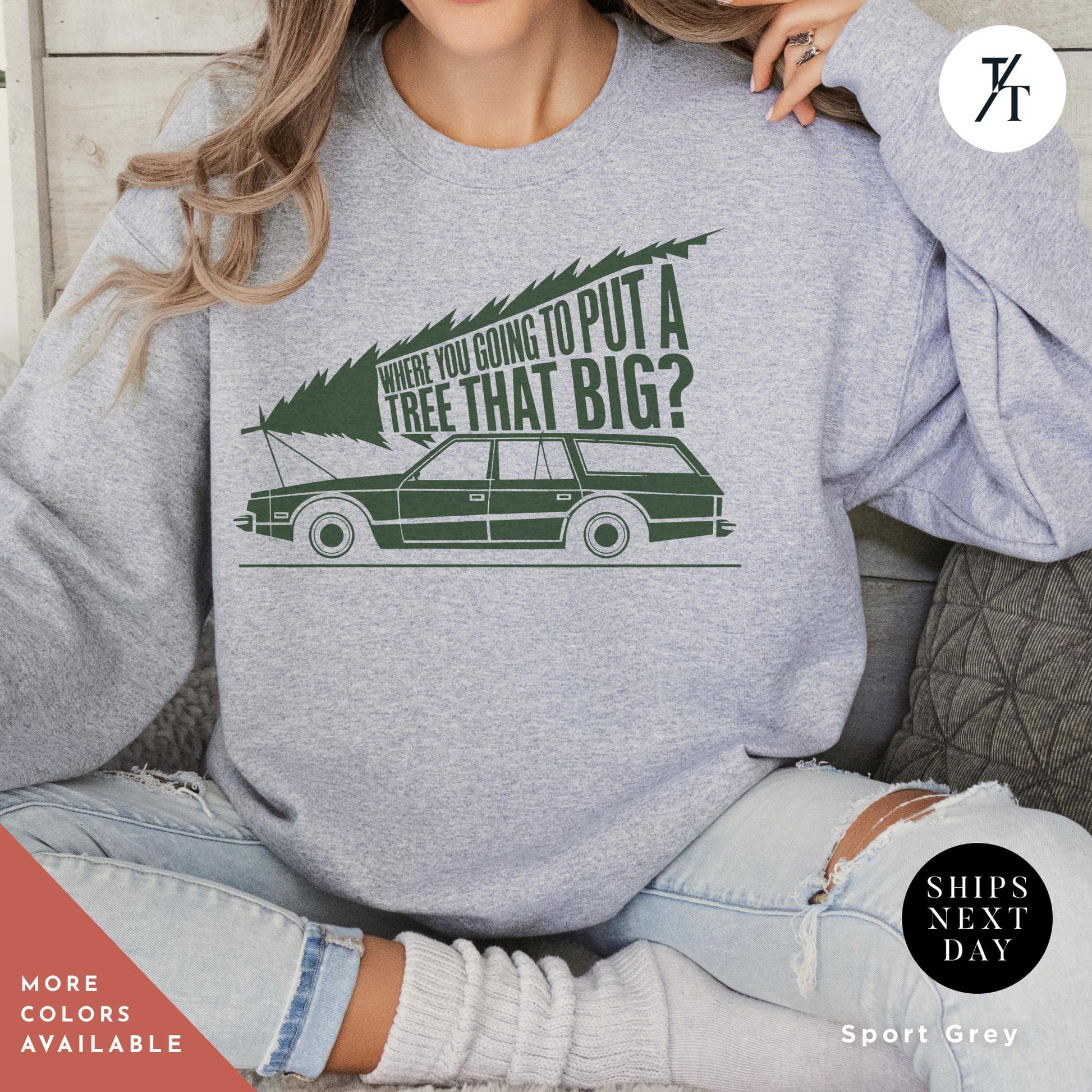 a woman sitting on a chair wearing a grey sweatshirt, You&#39;Re Gonna Put A Tree That Big Unisex Sweatshirts, Funny Christmas Gift, Griswold Sweatshirt, Christmas Sweatshirts for Christmas Vacation